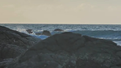 Sunset background at tropical beach with sea waves in slow motion Stock Footage 86294977