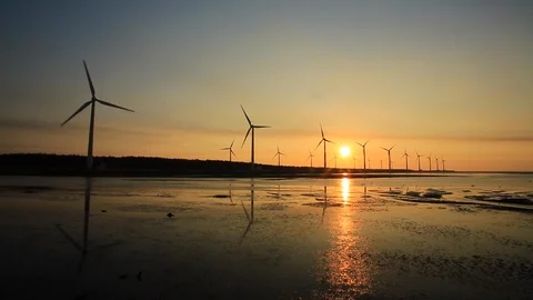 Sunset backlit , windmills and coast Stock Footage 90905317