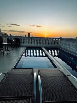 Sunset on the balcony with a pool Stock Photos