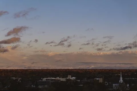 Sunset from balcony of a tall building on a cloudy day, sunset overlooking Stock Photos