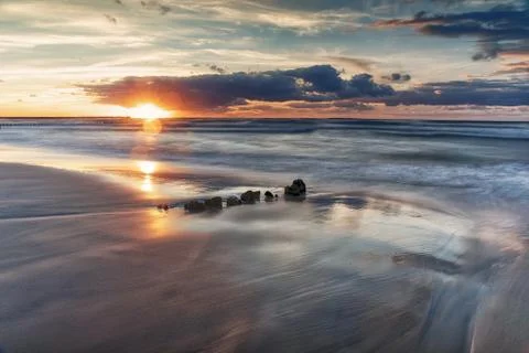 Sunset on the Baltic beach Stock Photos