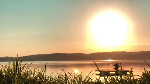 Sunset on the bank of the lake Stock Footage 95389859