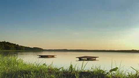 Sunset on the bank of the lake Stock Footage 95389972