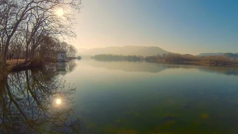 Sunset at Banyoles lake on a cold winter misty day Stock Footage 103136184