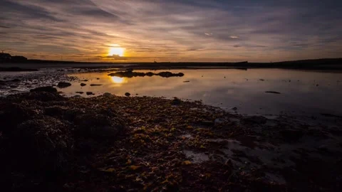 Sunset at the Barriers in Orkney while tide going out 4K Time Lapse Stock-Footage 256081866
