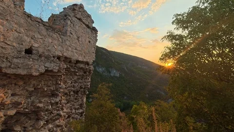 Sunset bathes ancient stone ruins in golden light. Soko Grad, Serbia 動画素材 345896903