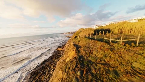 Sunset bathes cliff in golden light Stock Footage 340913783