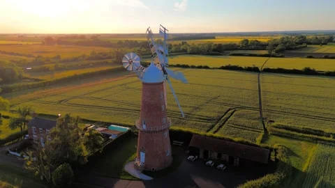 Sunset bathes old windmill in golden light 스톡 동영상 342611361
