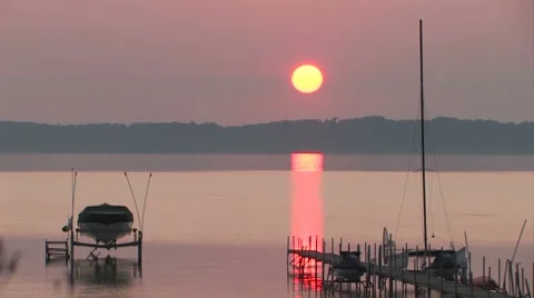 Sunset on a bay with boats and docks Stock Footage 7762575