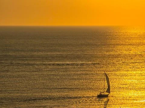Sunset in a bay with lots of sea on a vacation trip Stock Photos