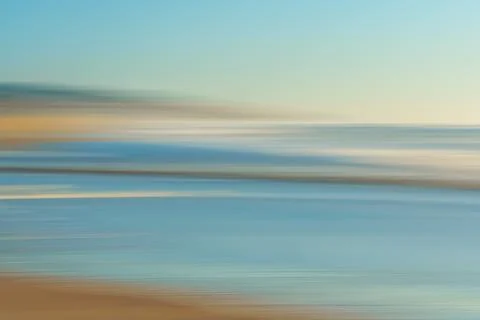 Sunset on the beach, abstract. Motion blur abstract seascape in light turqu.. Stock Photos