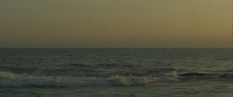 Sunset on the beach with anamorphic flare, 3K, Red One Stock Footage 46025248