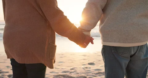 Sunset, beach and closeup of couple holding hands by ocean for commitment 動画素材 244866113