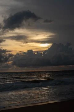 Sunset beach and cloudy sky Stock Photos
