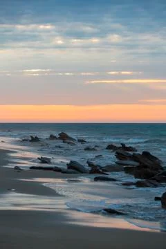 Sunset on the beach and the Pacific Ocean in Punta Sal, Peru Stock Photos