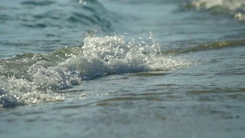 Sunset on the beach and waves splashing Stock Footage 212745713