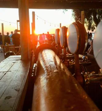 Sunset at a beach bar Stock Photos