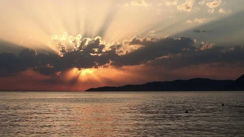 Sunset on a beach behind clouds Stock Footage 81312074