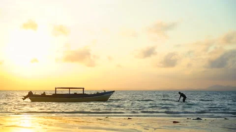 Sunset on the beach with Boat Stock Footage 147699700
