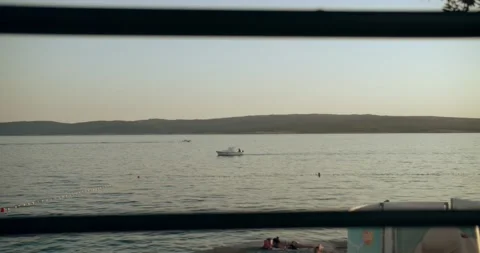 Sunset beach boat passing by closer Vidéo 141741842