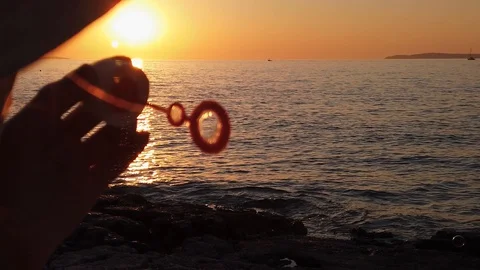 Sunset beach bubbles Slomo Closeup 4K UHD Stock Footage 128303180