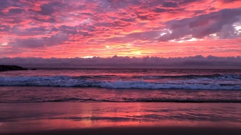 Sunset at beach with coastal waves and beautiful red color light Stock Footage 120381572