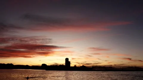 A sunset at the beach with colorful clouds Stock Footage 260668999