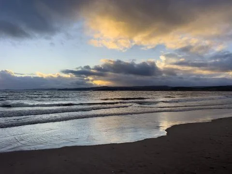 Sunset on a beach in Devon Foto stock