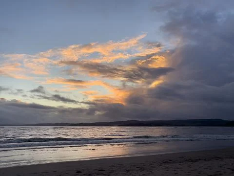 Sunset on a beach in Devon Stock Photos