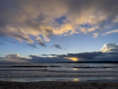 Sunset on a beach in Devon Stock Photos