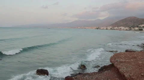 Sunset on the beach with distant mountains silhouettes Stock Footage 51318740