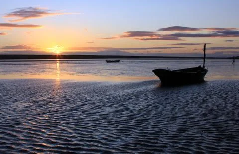 Sunset beach dorset Stock Photos