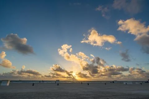 Sunset on Beach During Low Tide Stock Photos