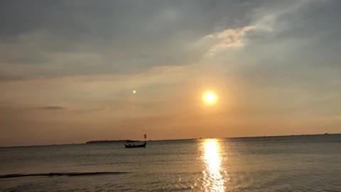 Sunset on the beach enjoying the view on the opposite island Stock Footage 230033805