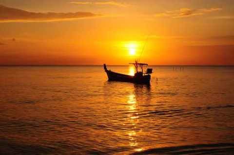 Sunset at the beach in the evening Фото