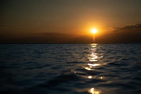 Sunset on the beach in the evening. Stock Photos