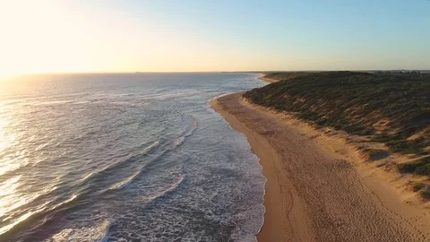Sunset on a beach - Flying Drone 4k Video stock 71697587