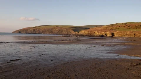 Sunset on beach front on a winter's evening Stock Footage 242673254