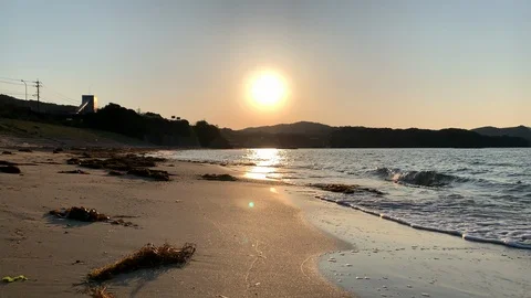 Sunset beach with gentle wave at local area in Japan Stock Footage 107786699