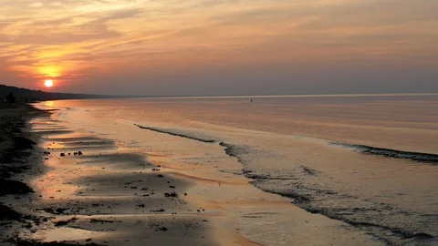 Sunset at beach with gently moving soft wave Vídeo Stock 96517216