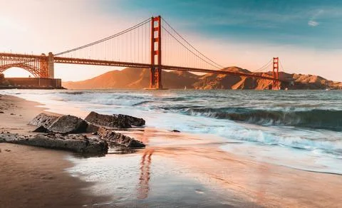 Sunset at the beach by the Golden Gate Bridge in San Francisco California Stock Photos