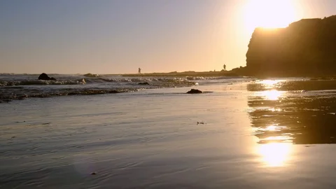 Sunset at the beach with golden sands Stock Footage 128641954
