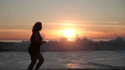 Sunset Beach Jogger-FAT Stock Footage 33546781