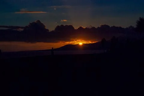 Sunset on the beach of lanzarote, backlight in which you can see the sun and Stock Photos