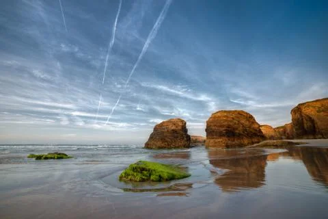 Sunset on the beach of Las Catedrales Stock Photos