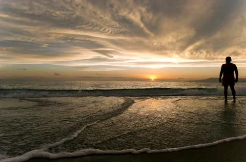 Sunset Beach Man in awe. Stock Photos
