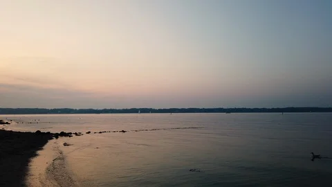 Sunset on the beach in northern Germany. Beach smoothly swimming into the scene Stock Footage 114977155