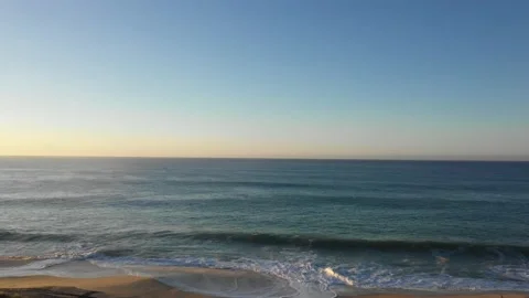 Sunset on the beach Ocean with sand 4k aerial shot Video stock 152483489