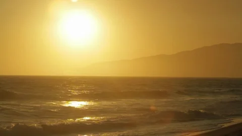 Sunset. On beach ocean water. slowmo B Stock Footage 102404008