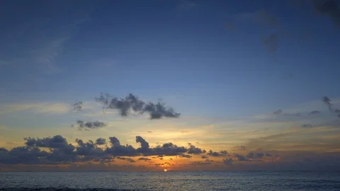 Sunset beach in ocean with waves and blue sky and clouds Stock Footage 113268638